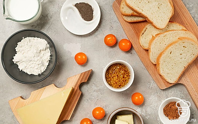 Достаньте заранее из холодильника молоко и сливочное масло. Натрите сыр на средней терке. Помойте и разрежьте на дольки помидоры черри. Тимьян промойте, обсушите и мелко нарежьте.