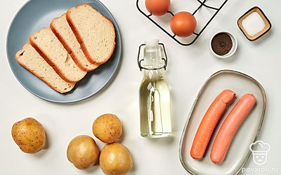 Вымойте картофель и яйца, очистите картошку от кожуры. Снимите с сосисок упаковку. Нарежьте хлеб на ломтики. Зеленый лук для подачи вымойте, обсушите на бумажных полотенцах, измельчите.