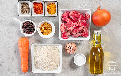 Промойте мясо. С лука и чеснока снимите шелуху. Промойте до прозрачности воды рис. Морковь почистите и помойте. Барбарис перед приготовлением замочите ненадолго в кипятке. Приготовьте казан или толстостенную кастрюлю.